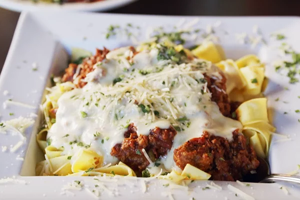 Eats signature dishes Jerk ChickenJerk PorkPasta with Meat SauceSweet Potatoes